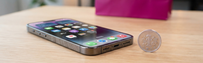 高級感のあるスマートフォンと、その横に置かれた「1円玉」。背景には楽天モバイルのブランドカラーをあしらったパッケージ